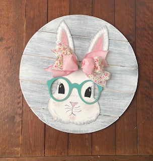 18 inch round with adorable bunny wearing teal glasses and pink ribbon
